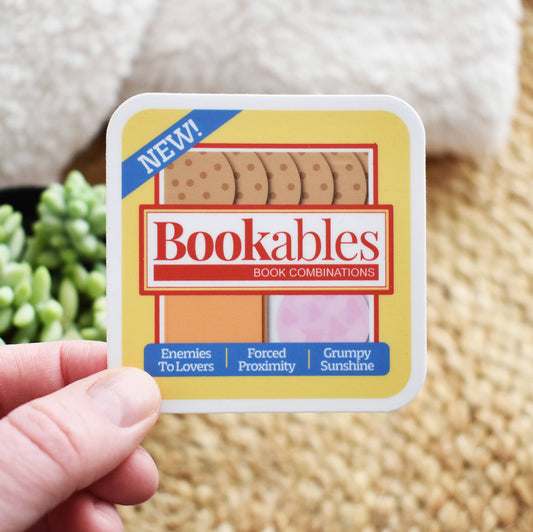 Hand holding a 'Bookables' product packaging with a blurred background
