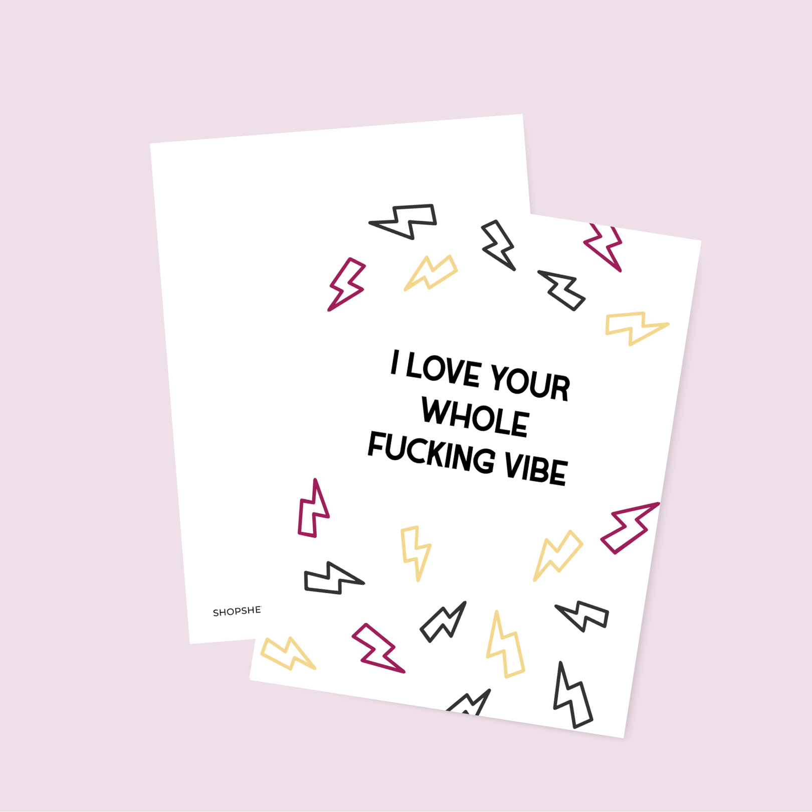 Two printed sheets with colorful lightning bolt designs and text on a light pink background