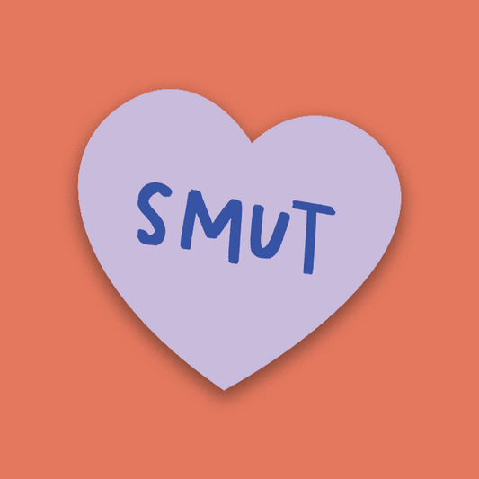 Heart-shaped purple candy with 'SMUT' text on a brown background