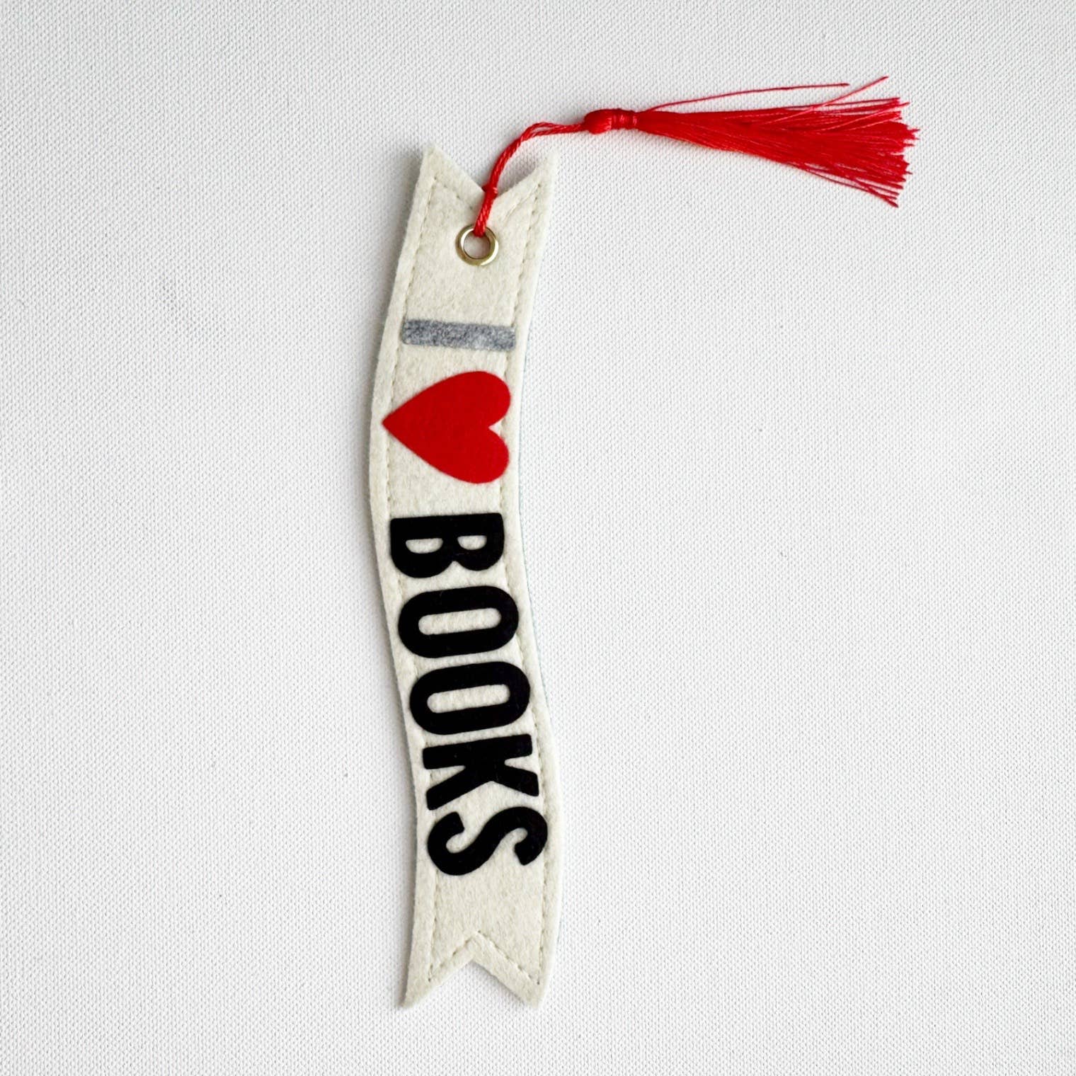 Bookmark with a heart and 'LOVE BOOKS' text on a white background