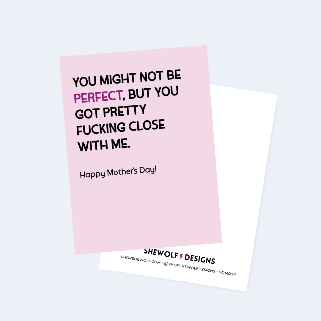 Card with humorous Mother's Day message on a pink background, featuring the brand 'Shewolf Designs'.