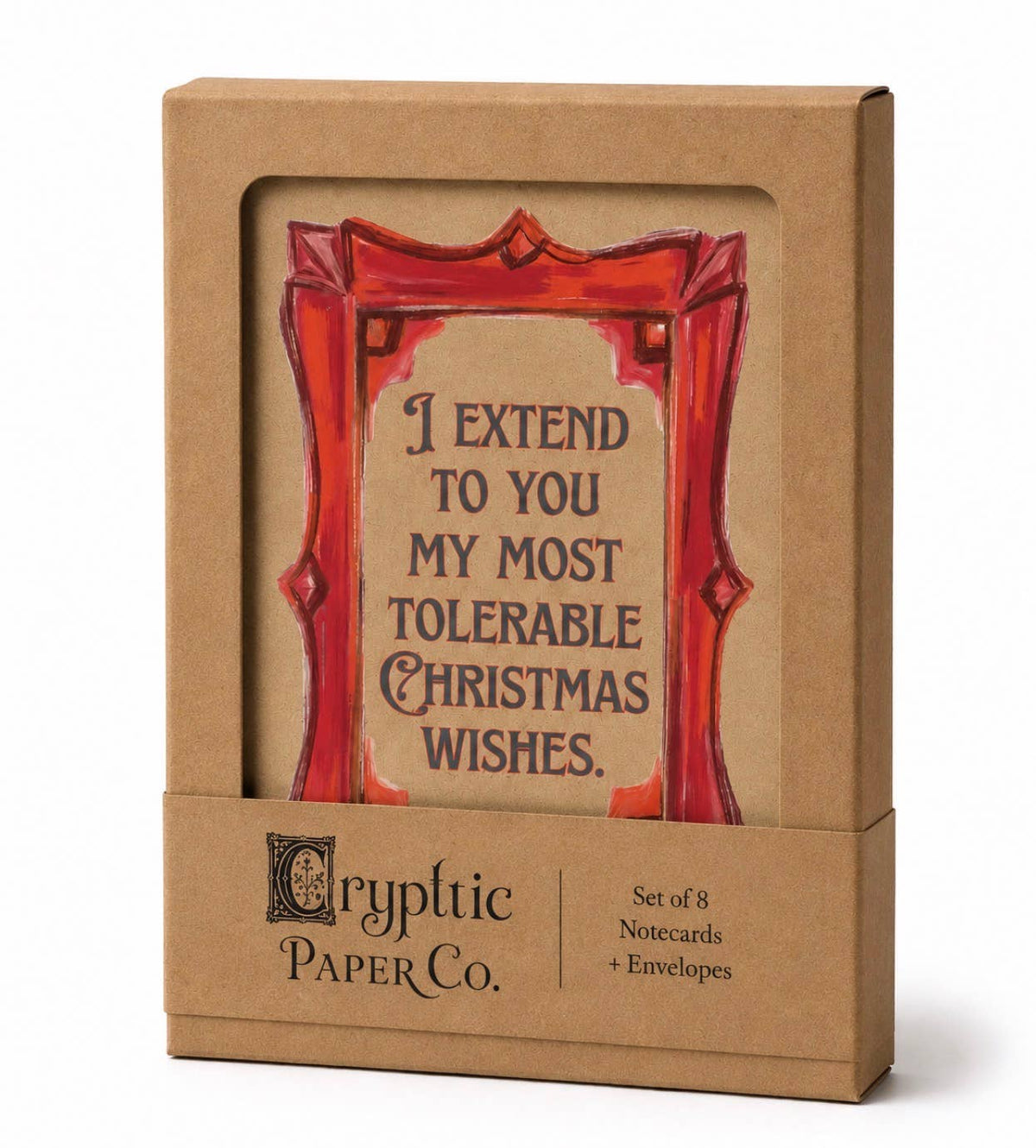 Cryptic Paper Co. Christmas notecard set in a brown kraft paper box with a clear window showing a red and beige notecard, plus matching envelopes in the slot base.