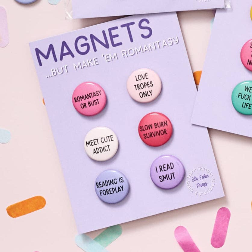 Set of colorful buttons on a card labeled 'MAGNETS' with various text designs.