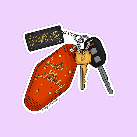 Keychain with keys, 'Getaway Car' sign, and 'fuck the patriarchy' tag on a light purple background