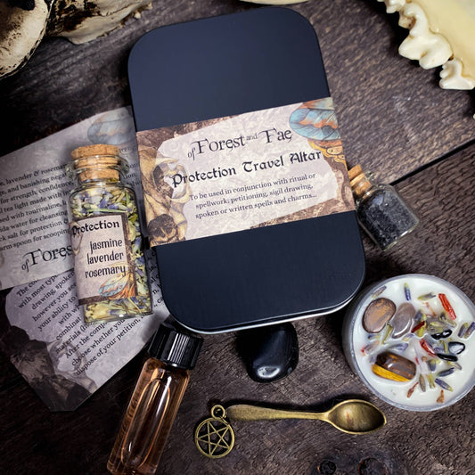 Protection travel altar set with bottles, spoon, and book on a wooden surface