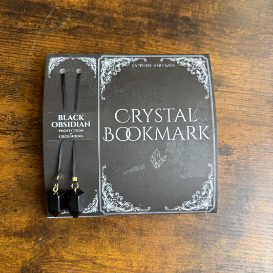 Crystal bookmark packaging on a wooden surface