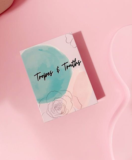 Card with 'Tropes & Truths' text on a pink background