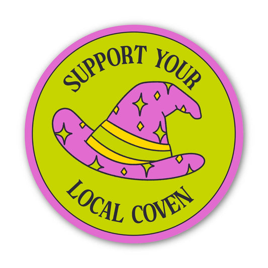 A circular sticker or badge design with a bright lime green background, pink border, and a pink wizard hat with yellow stars and stripes. The text reads 'SUPPORT YOUR LOCAL COVEN' in dark lettering.