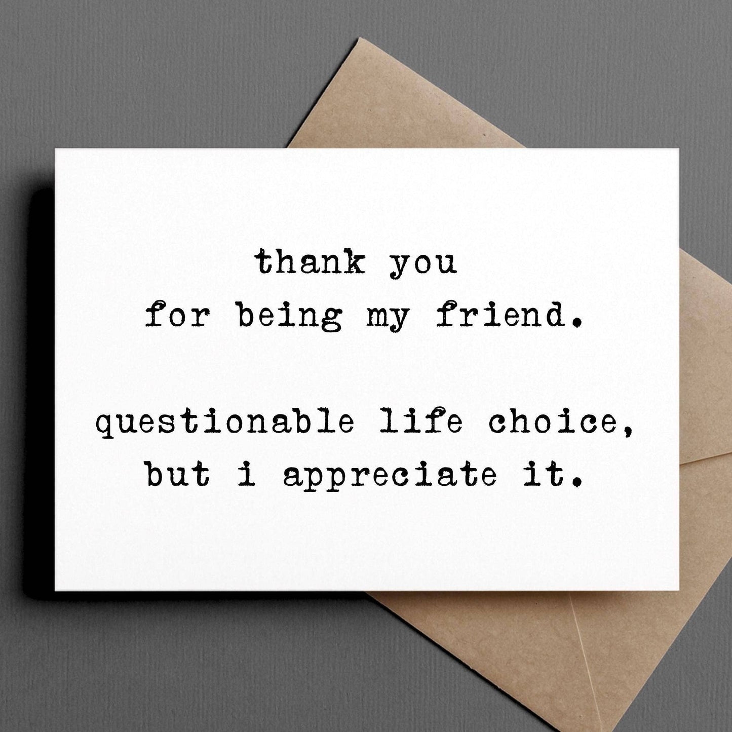 Card with text 'thank you for being my friend. questionable life choice, but I appreciate it.' on a gray background.