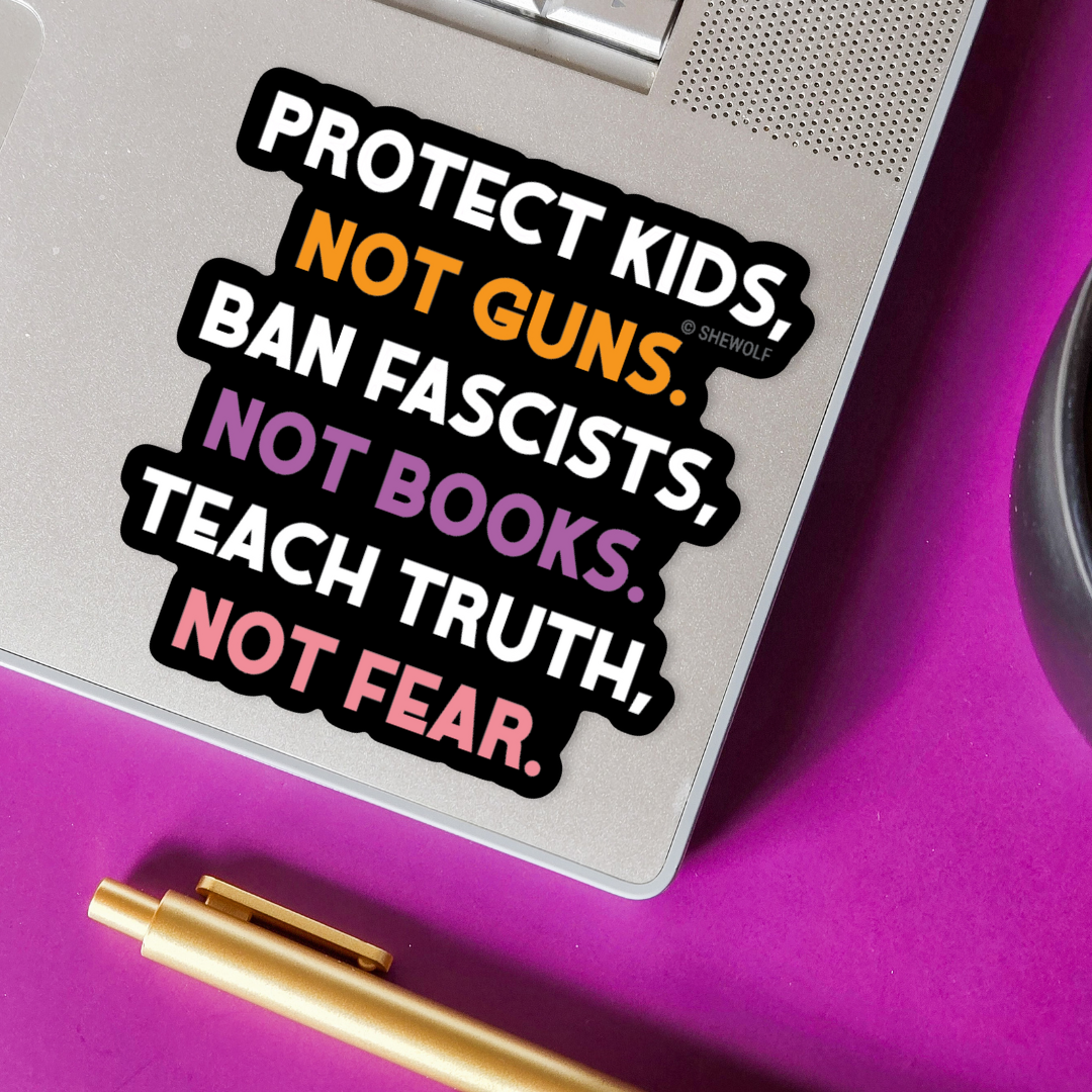 Sticker with political message on a laptop with a purple background