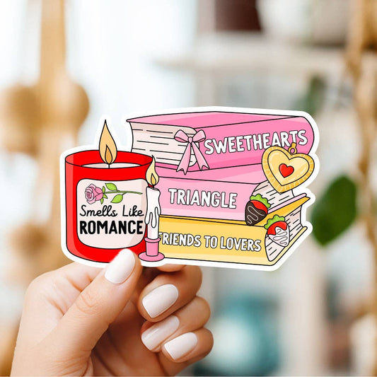 Sticker with 'Sweethearts Triangle' design held by a hand