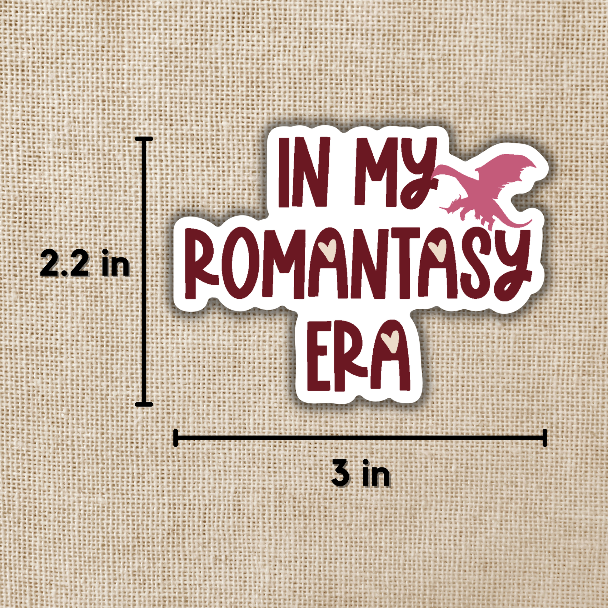 Sticker with 'In my romantsy era' text and a measurement label on a textured beige background