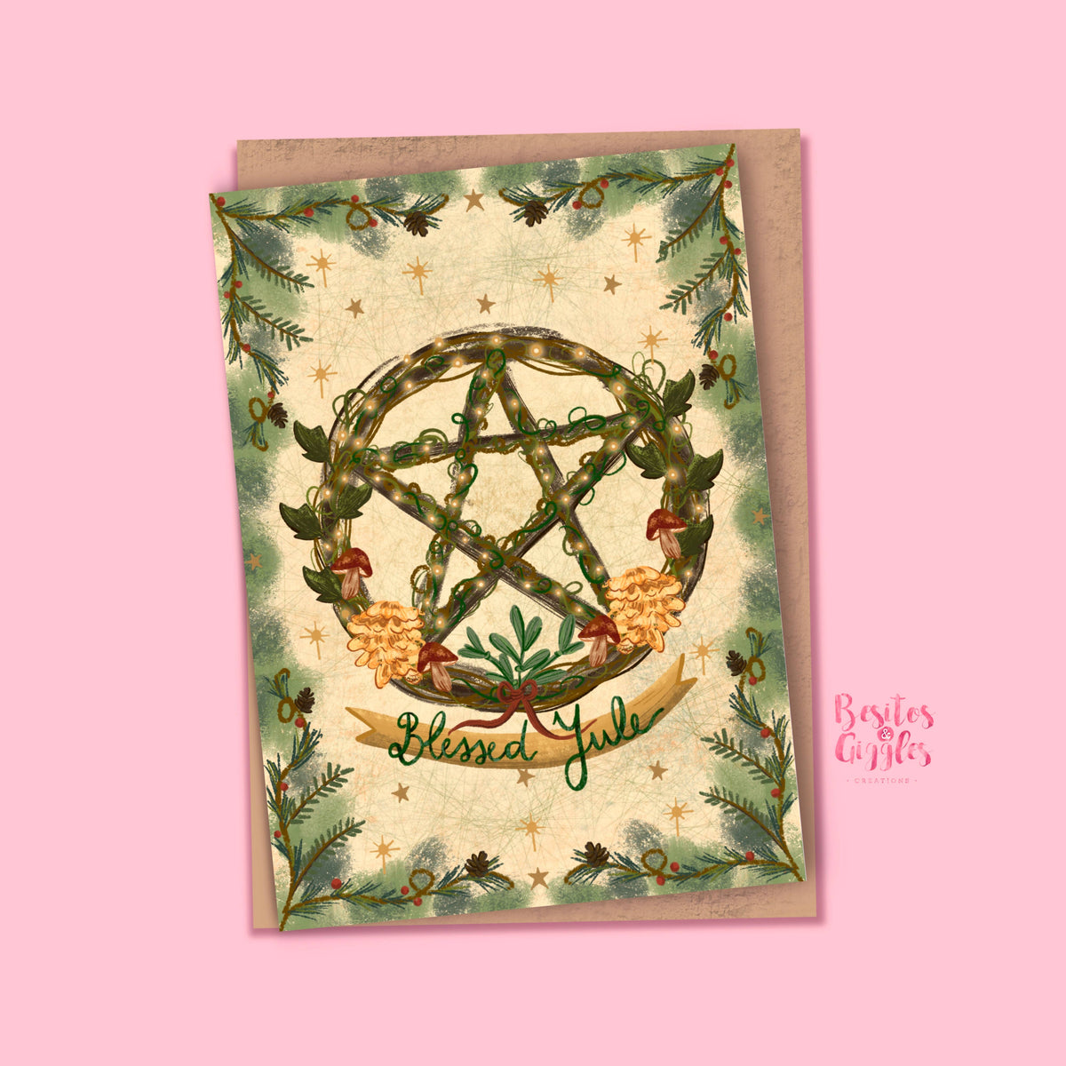 A square greeting card with a kraft envelope, featuring a green pentagram wreath, pine branches, and the words 'Blessed Y'all' on a light pink background. A 'Besties Gifts' watermark is visible on the right.