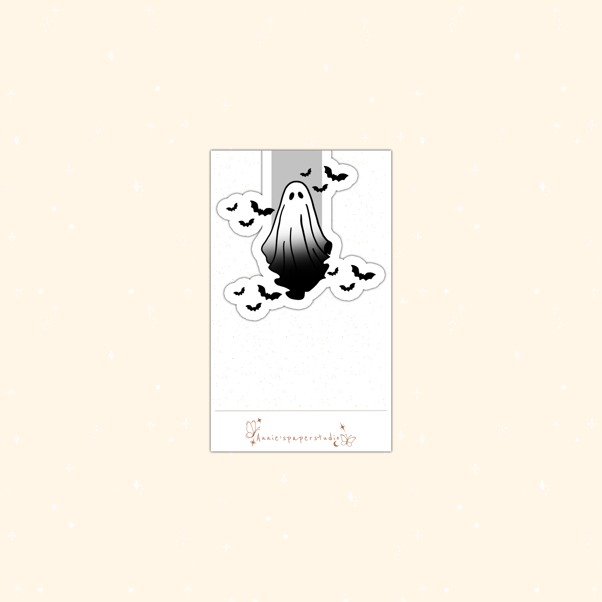 A Halloween-themed magnetic bookmark featuring a black and white dripping ghost surrounded by bats, presented on a white backing card with a small brand logo at the bottom.