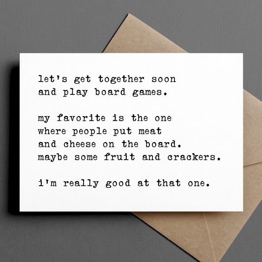 Greeting card with text about playing board games on a gray background