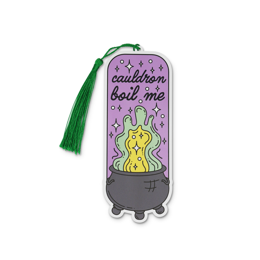 Sticker with a cauldron and text 'cauldron boil me' on a purple background with a green tassel.