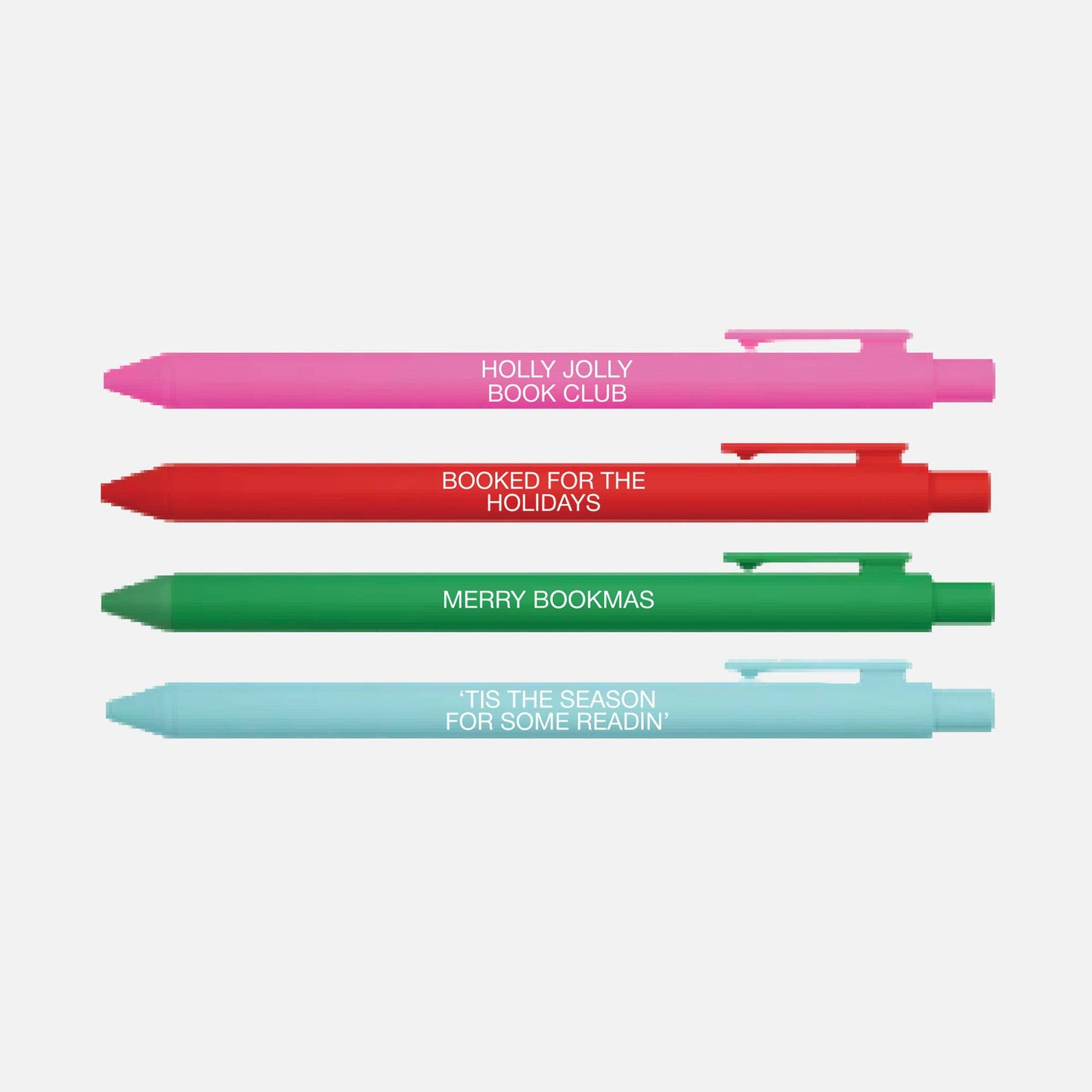 Four colorful pens with holiday-themed text on a white background