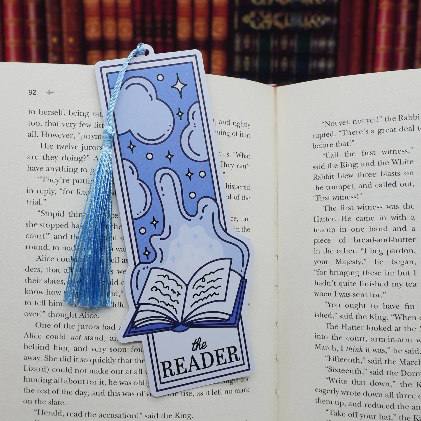 Blue bookmark with tassel on an open book