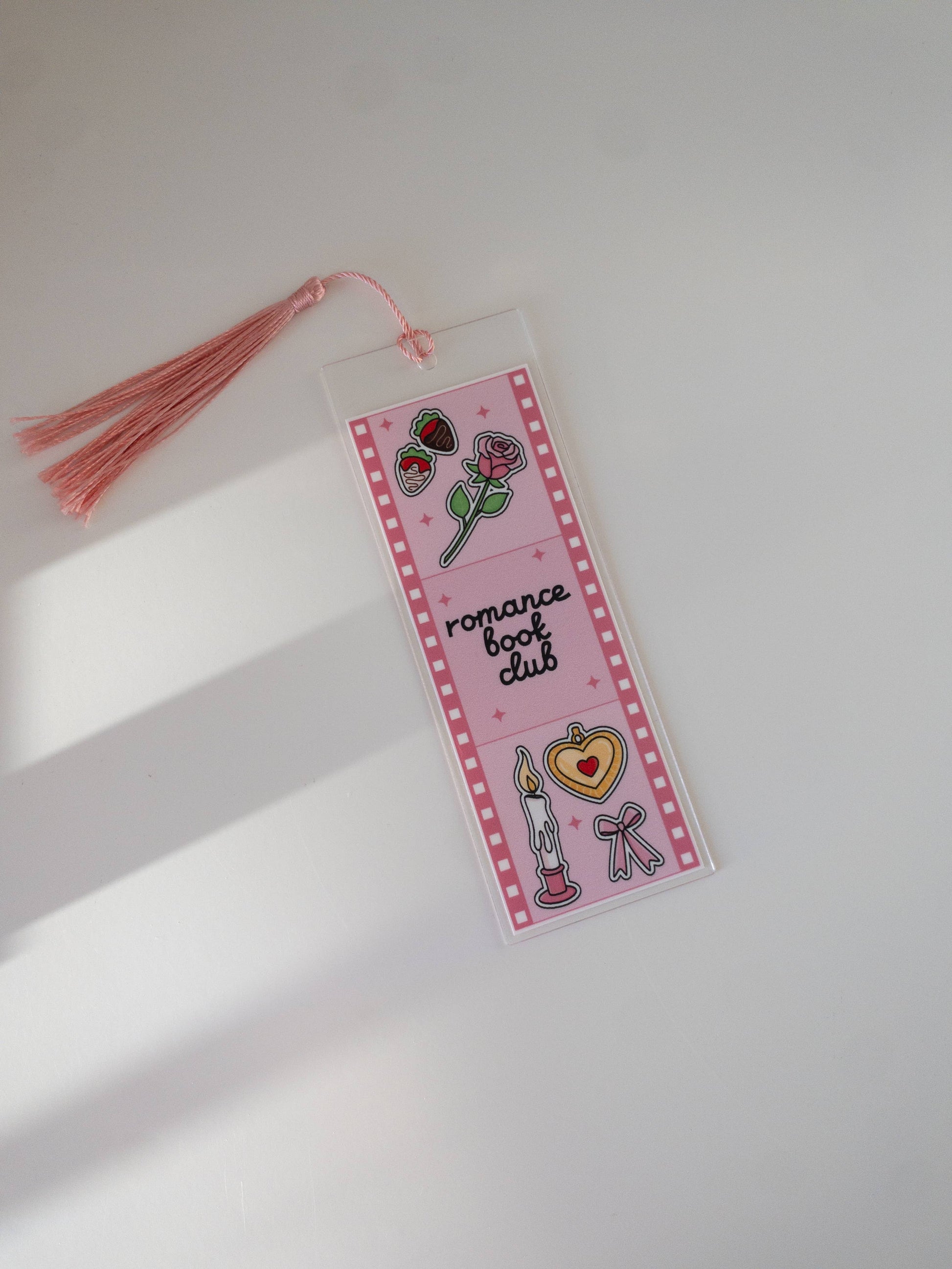 Bookmark with decorative elements and tassel on a light background
