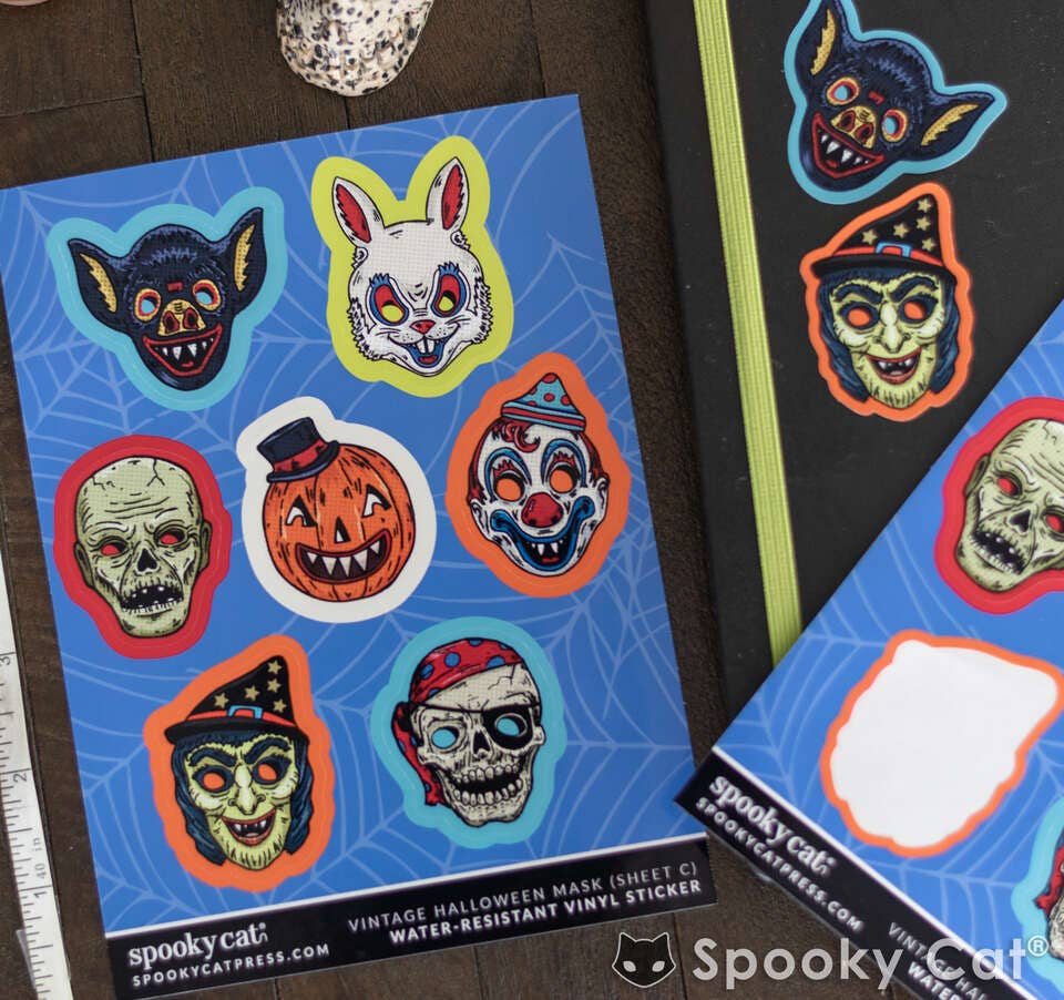 Halloween-themed stickers on a blue sheet with 'Spooky Cat' branding.