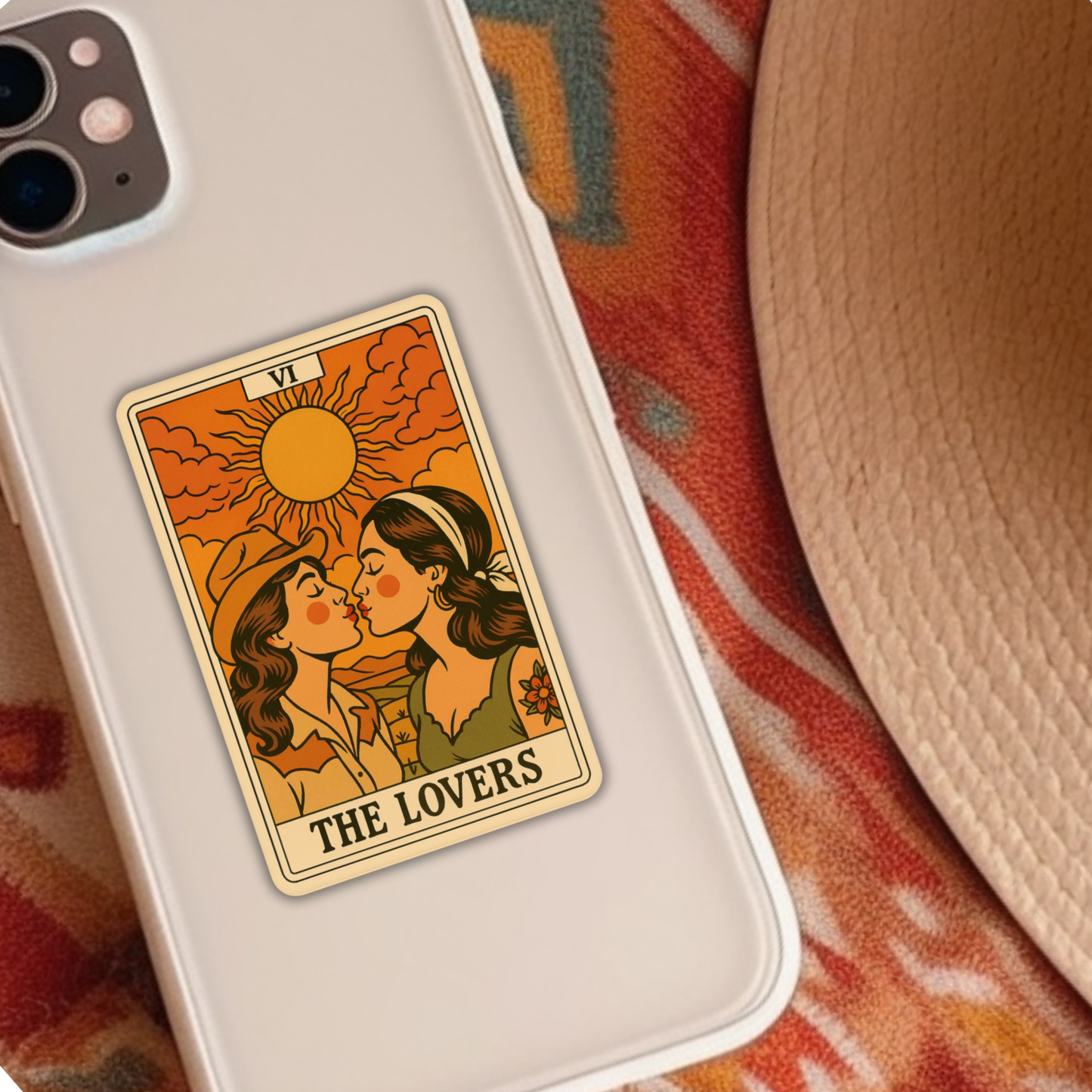 Phone case with 'The Lovers' tarot card design on a colorful fabric background