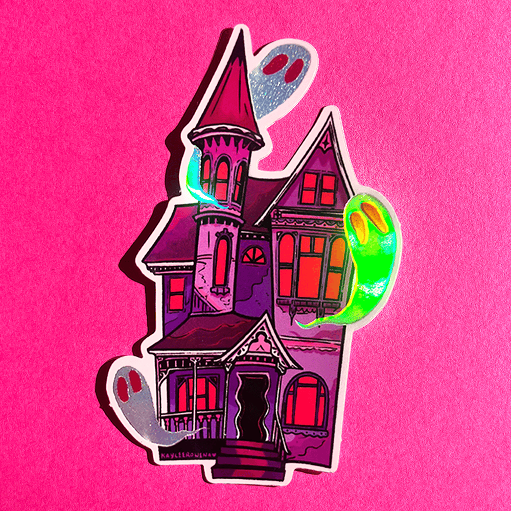 A die-cut sticker featuring a stylized haunted house with glowing neon green and silver ghosts, shown on a textured hot pink background.