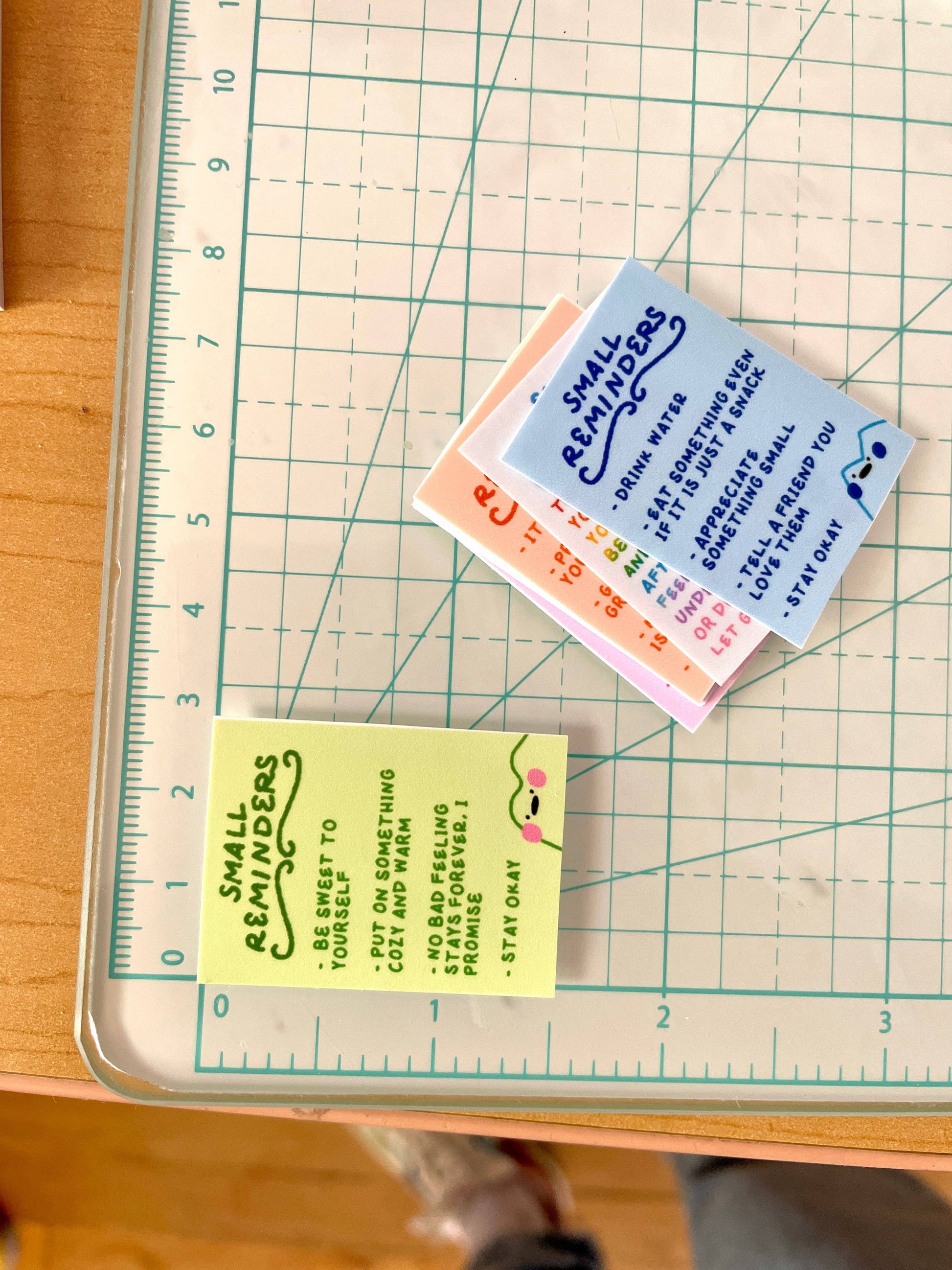 Small reminder notes on a cutting mat with a ruler for scale