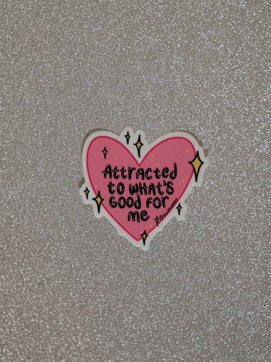 Pink heart-shaped sticker with text on a glittery gray background