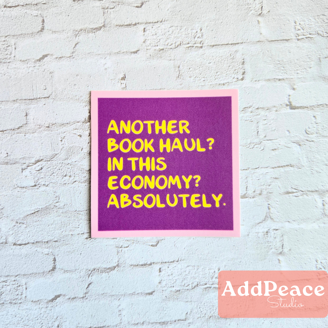 Purple sign with yellow text on a light blue brick wall, featuring the brand 'AddPeace Studios'.