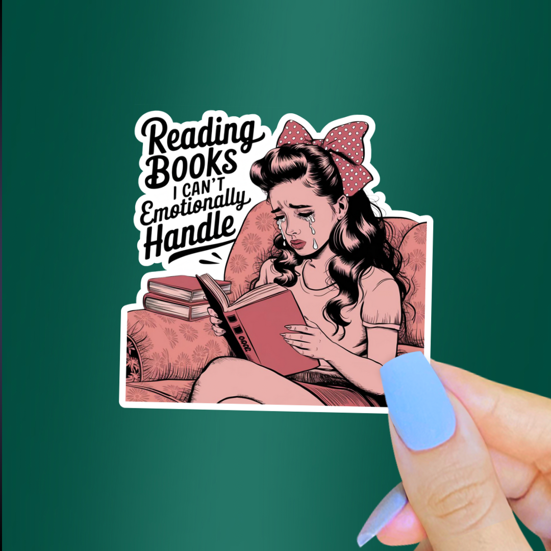 A die-cut sticker held by a hand against a solid dark green background. The sticker features a retro-style illustration of a woman with a red polka-dot bow reading a book, with the text 'Reading Books I CAN'T Emotionally Handle'.