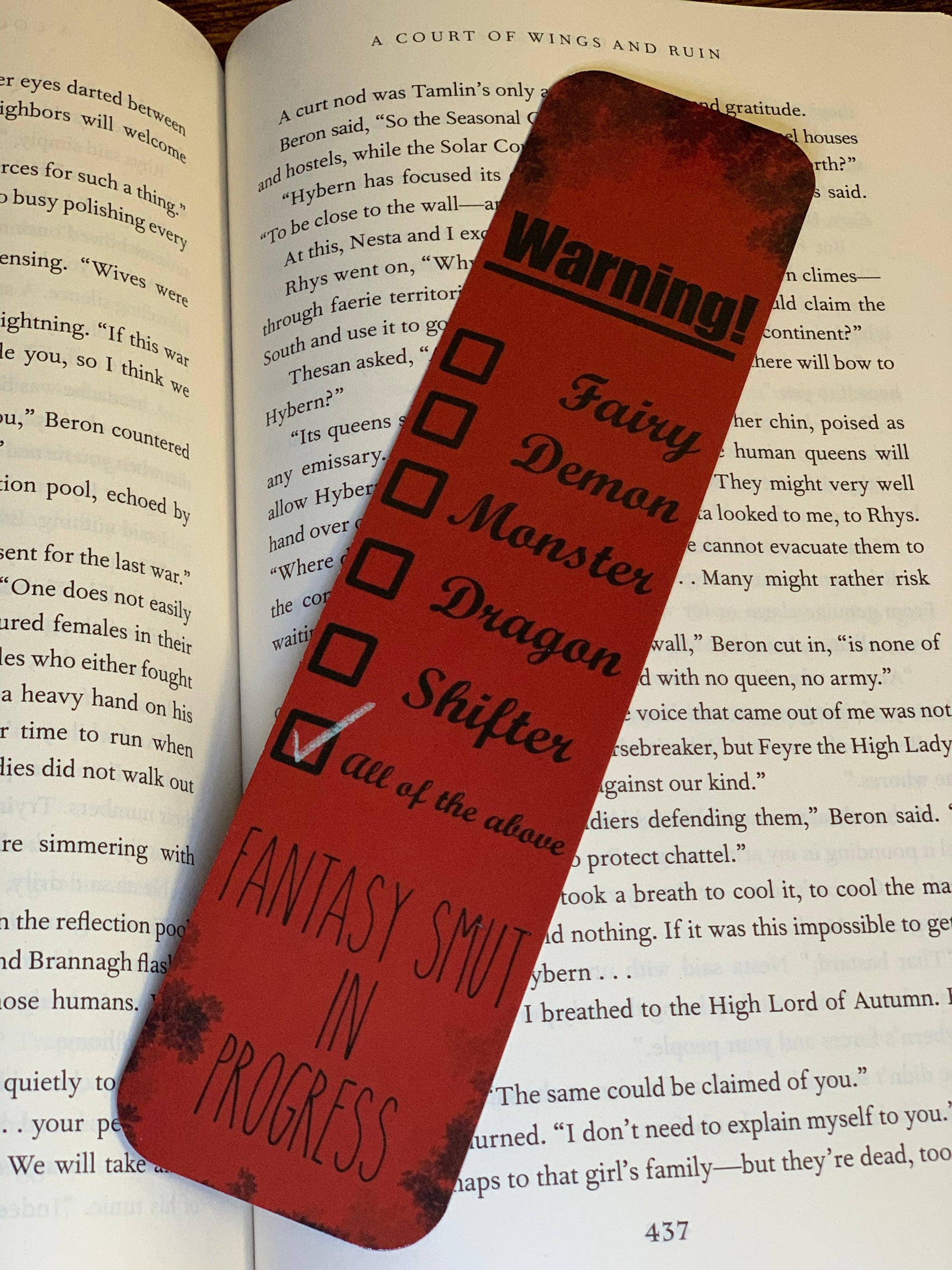 Red bookmark with text on a book
