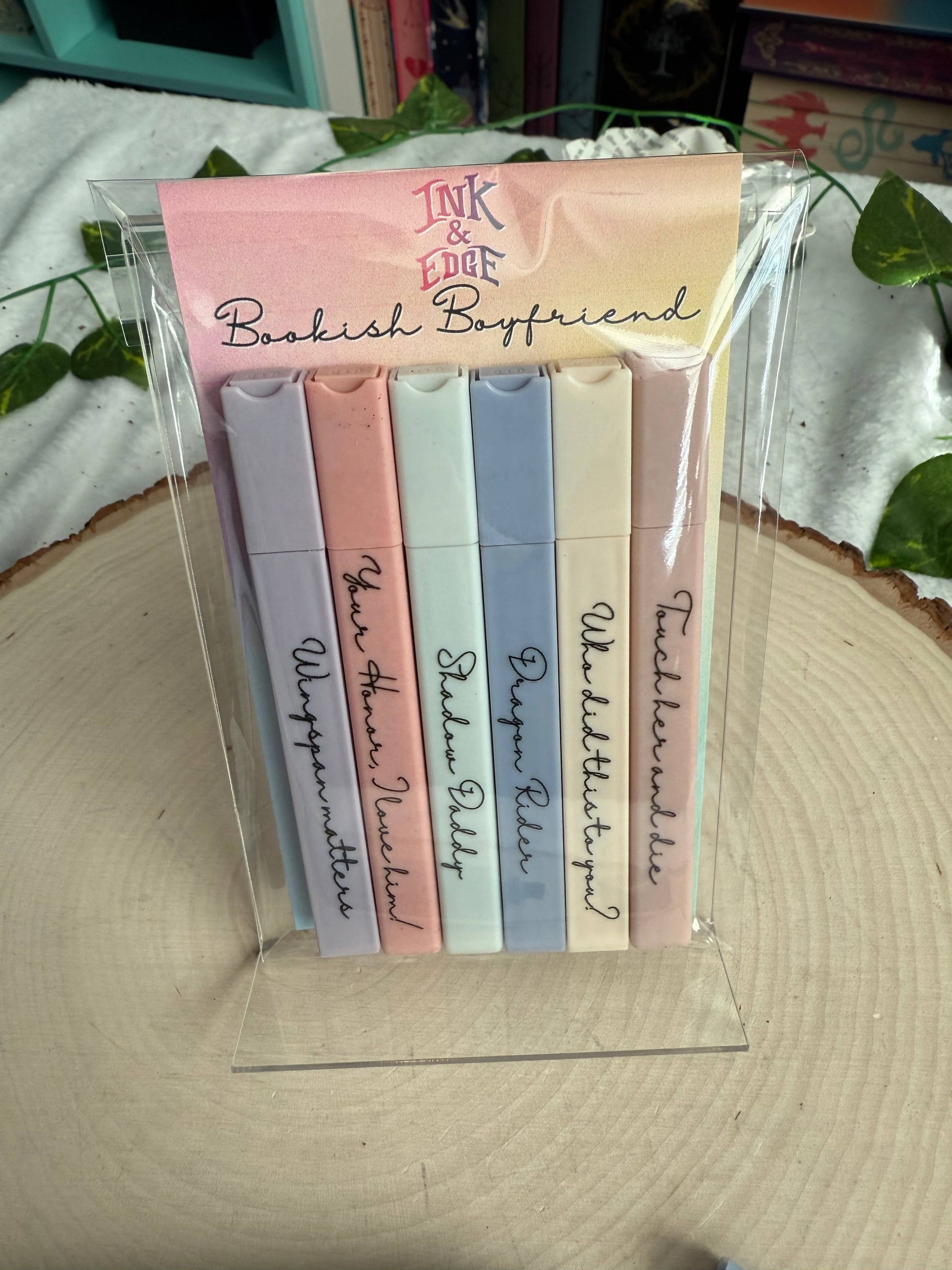 Set of pastel-colored bookmarks with text on a clear stand