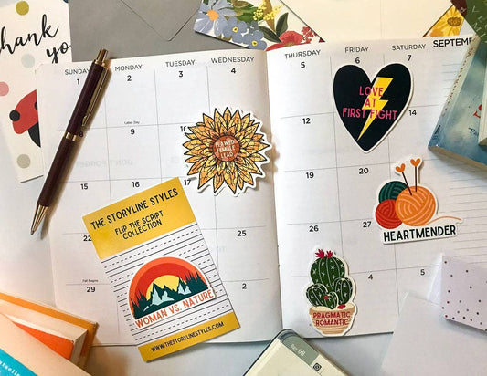 Calendar with stickers on a desk with stationery items